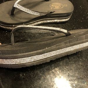 Size 7 black flip flops, purchased in Las Vegas
